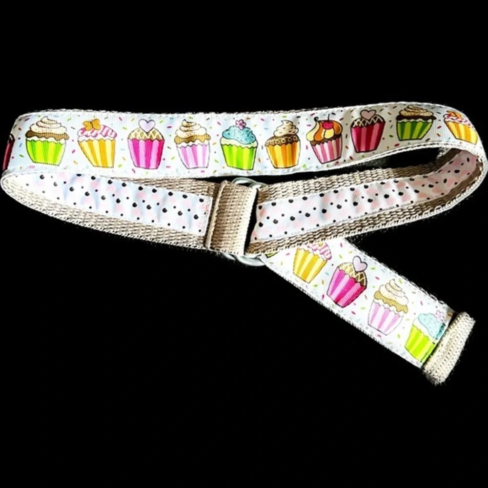 Belt, cupcakes and reverses to hearts on backside Celebrate in style.Adjustable